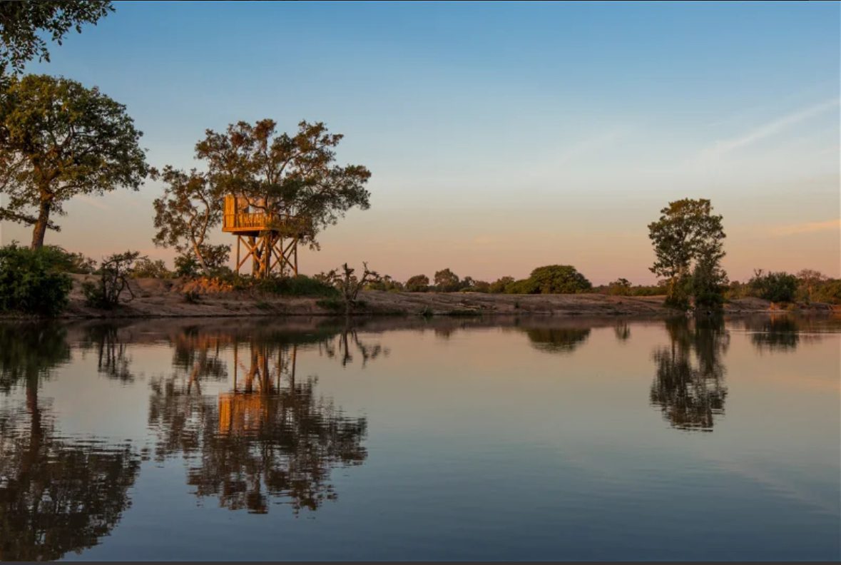 Treehouse and waterhole in Umlani Bush Camp, Timbavati Private Game Reserve, South Africa 