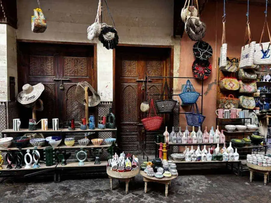 Medina, Marrakech: bags and pottery in a stall on the street