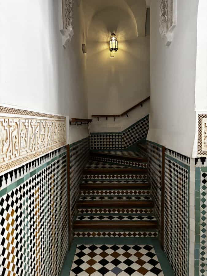 Beautifully tiled stairs in Medersa Ben Youssef, Marrakech, Morocco