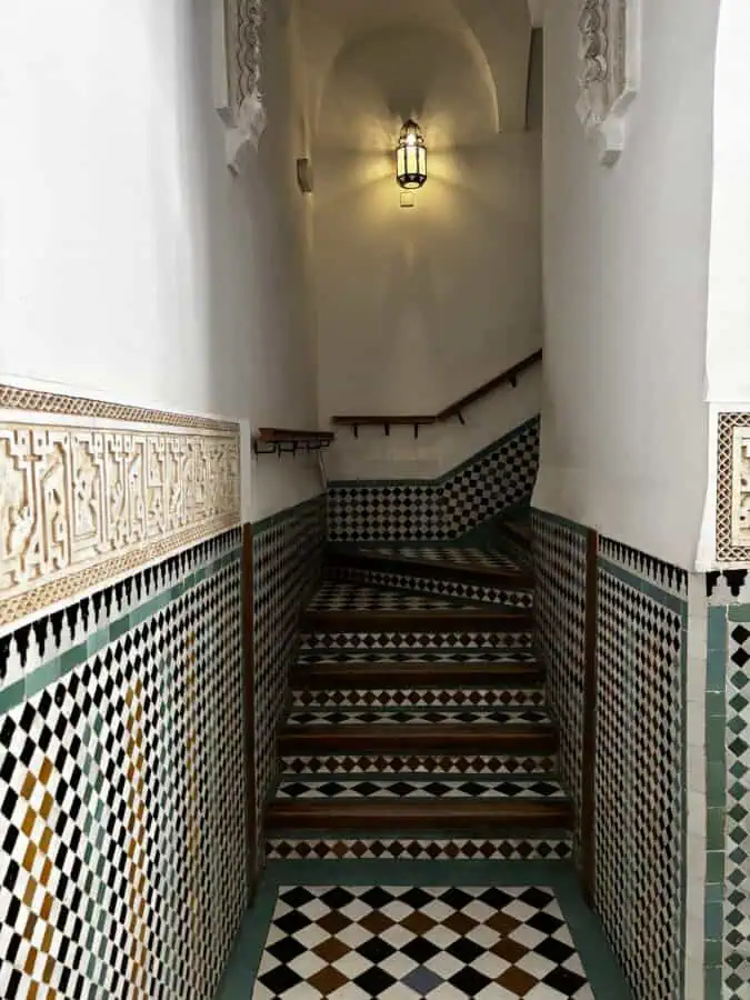 Beautifully tiled stairs in Medersa Ben Youssef, Marrakech, Morocco