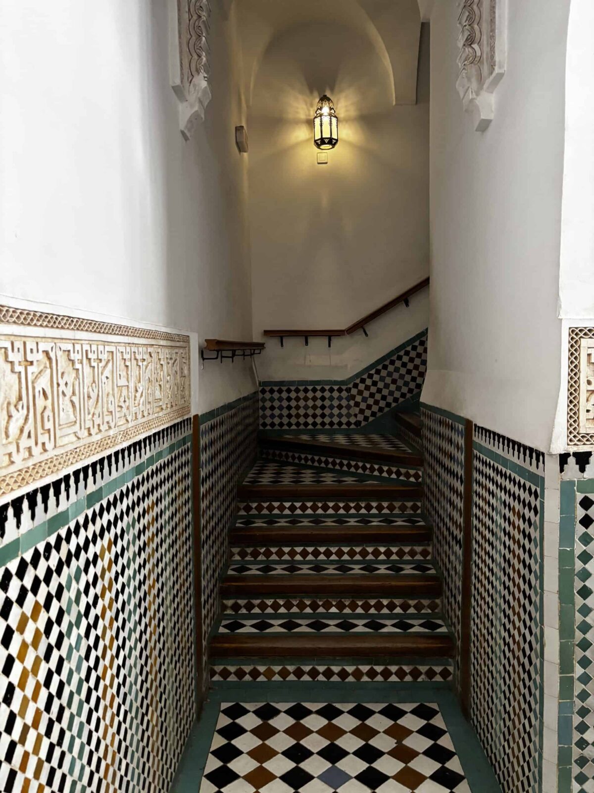 Beautifully tiled stairs in Medersa Ben Youssef, Marrakech, Morocco
