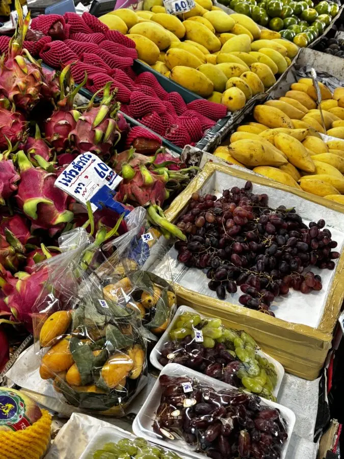 Market close up of grapes, mango, dates and other exotic fruits. Chiang Mai, Thailand