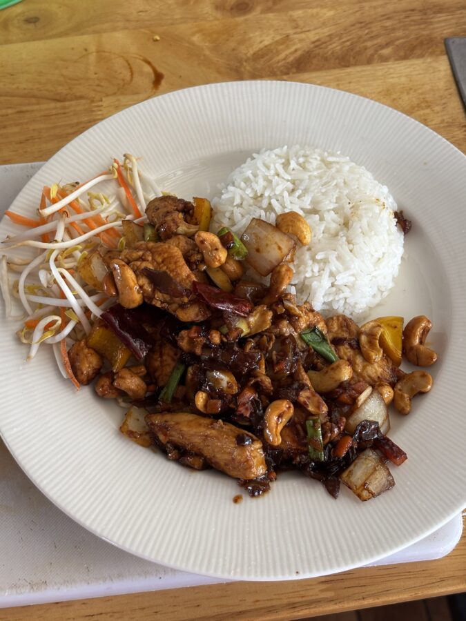 Plate of rice and chicken stir-fry, made in a Thai cooking class.