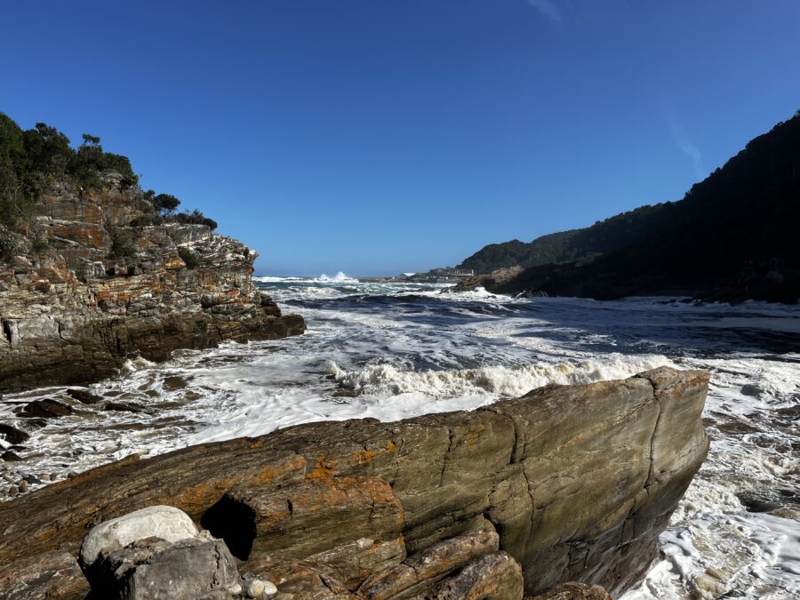 Rock with high waves in Tsitsikamma National Park, Storms River Mouth. One of our best hikes on the Garden Route