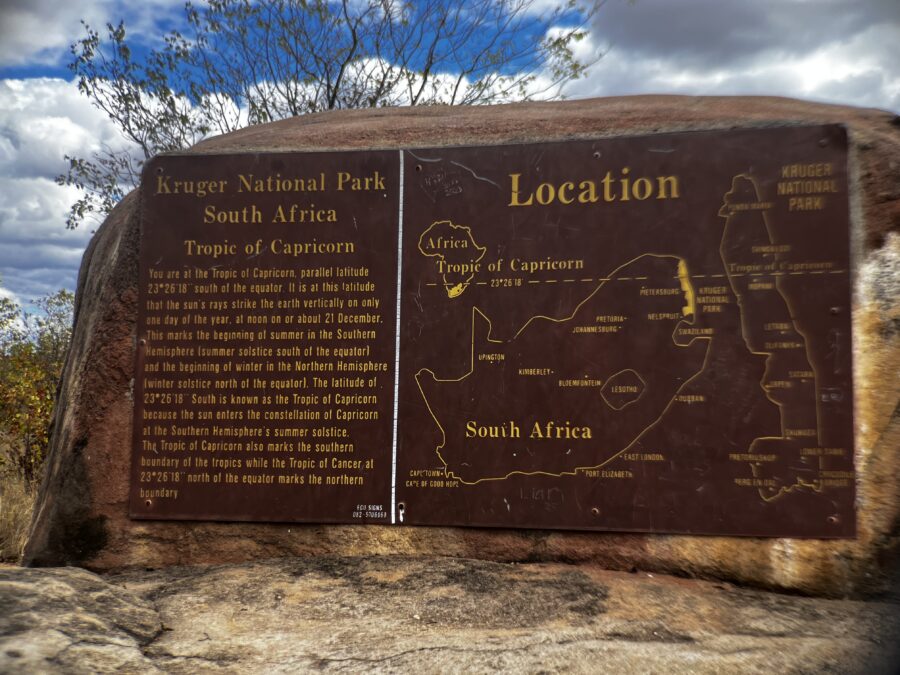 A sign indicating that you have reached the tropic of Capricorn, in Kruger National Park. Text and map. 