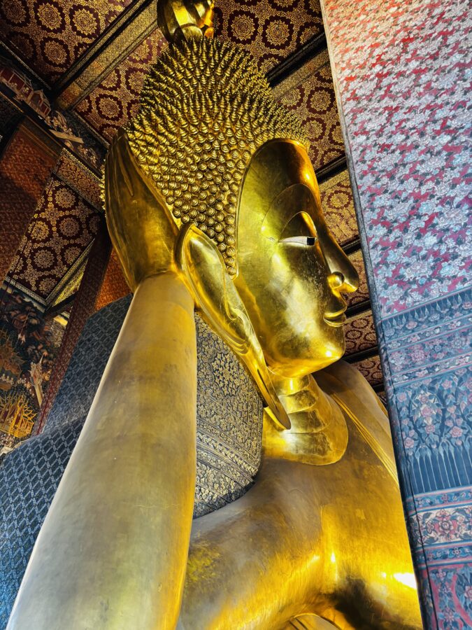 Gold reclining buddha seen up close, Bangkok, Thailand