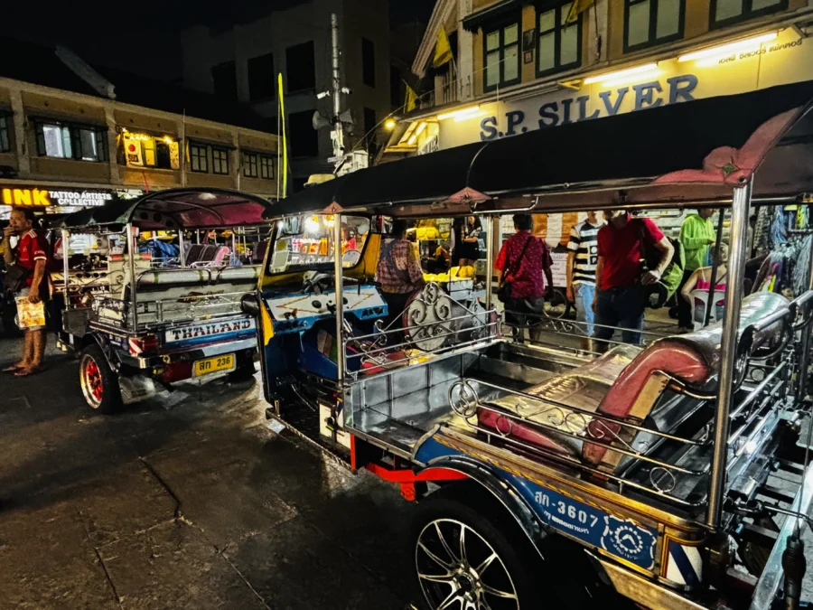 Tuktuks waiting for customers in the dark, Bangkok