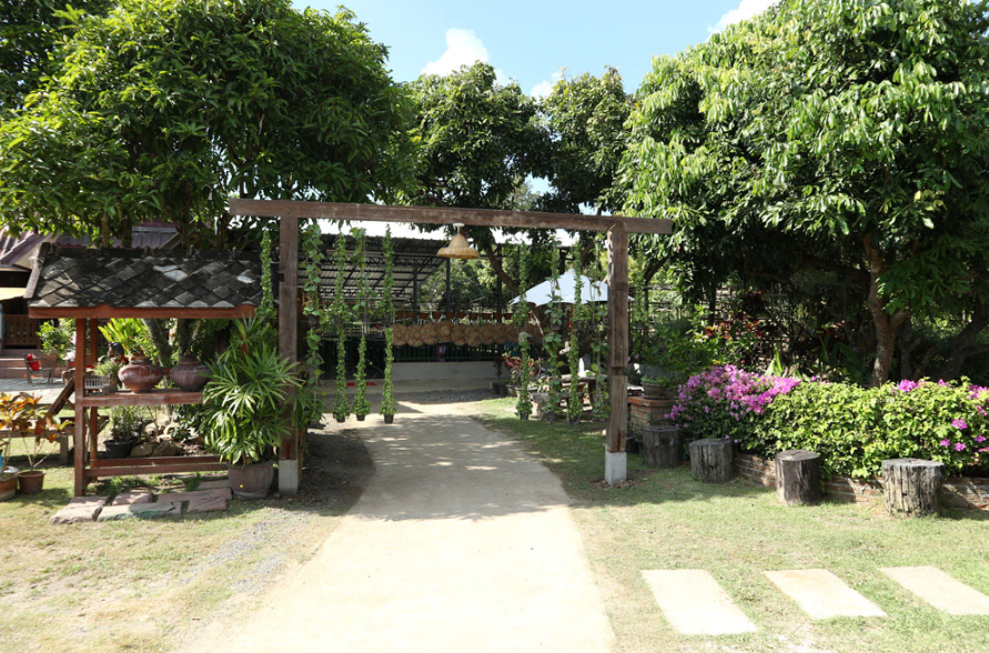 Entrance smile organic cooking farm: outdoor kitchen for Chiang Mai cooking class