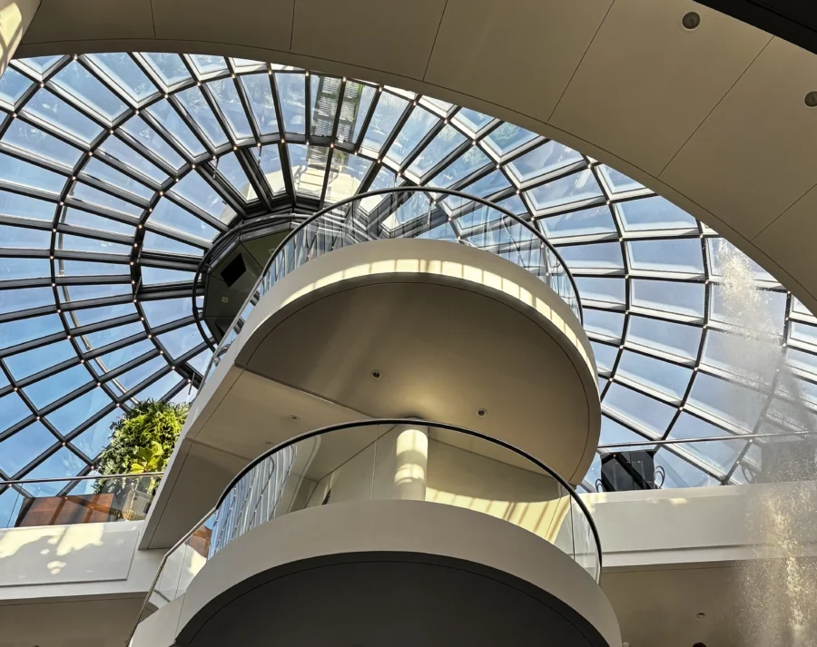 View of a glass ceiling with a winding staircase going towards it in Perlan museum, Iceland 