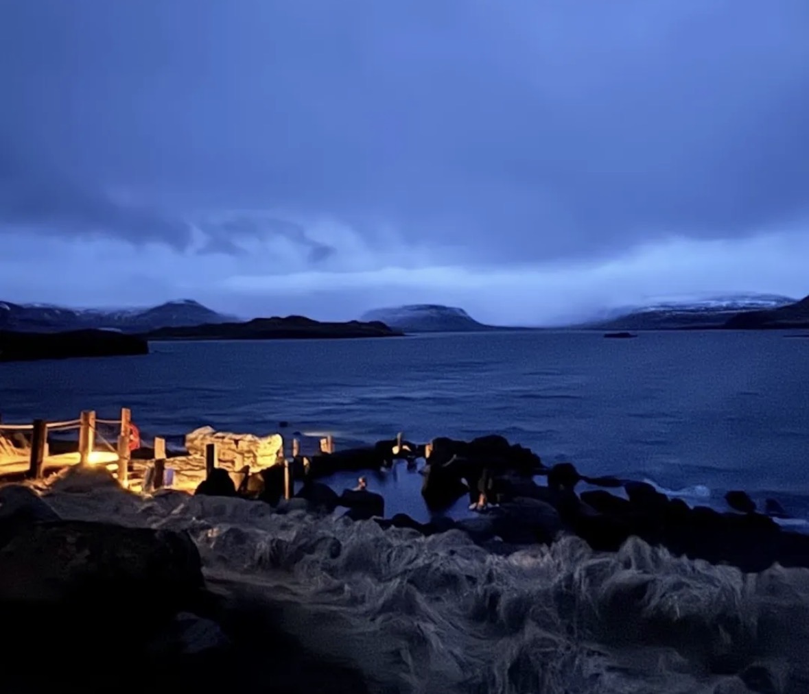 Partly lit thermal baths in Iceland at dusk 