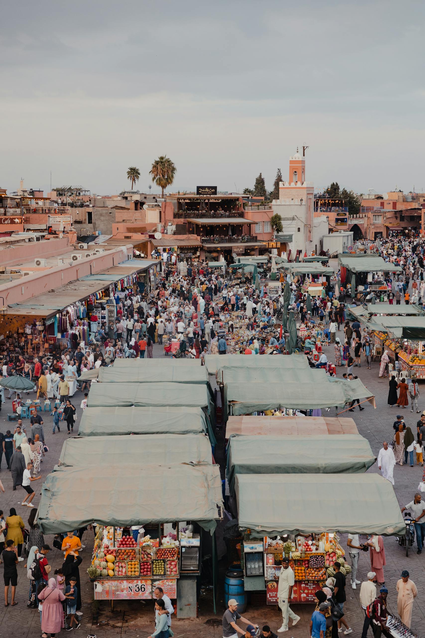 Aerial view of Jemaa El-Fnaa market in Marrakesh showcasing vibrant street life and stalls.
