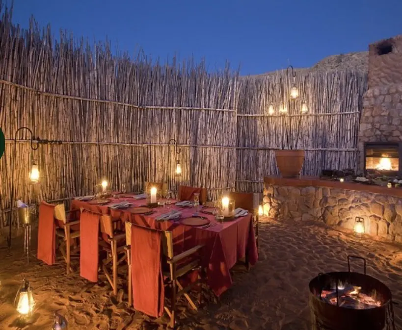 Laid-out table in a boma in a safari camp