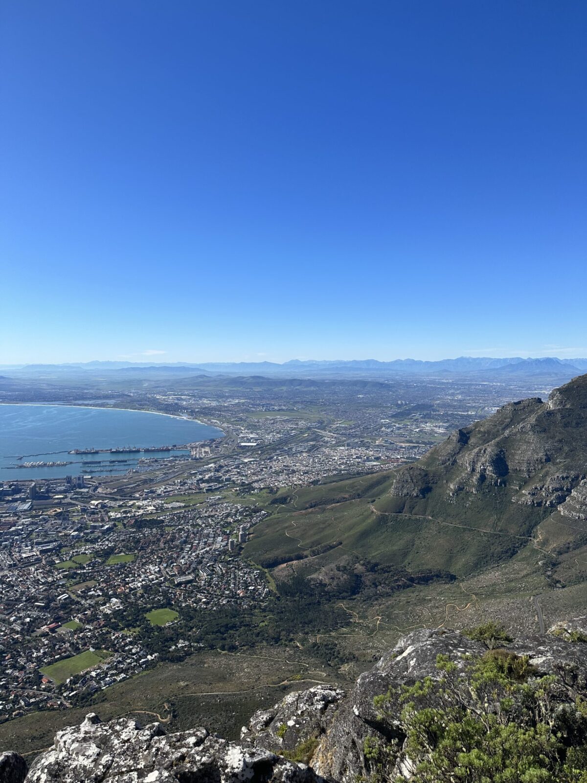 Cape Town seen from Table Mountain against a bright blue sky. One of the best day tours from Cape Town. Photo by Alexandra te Riele