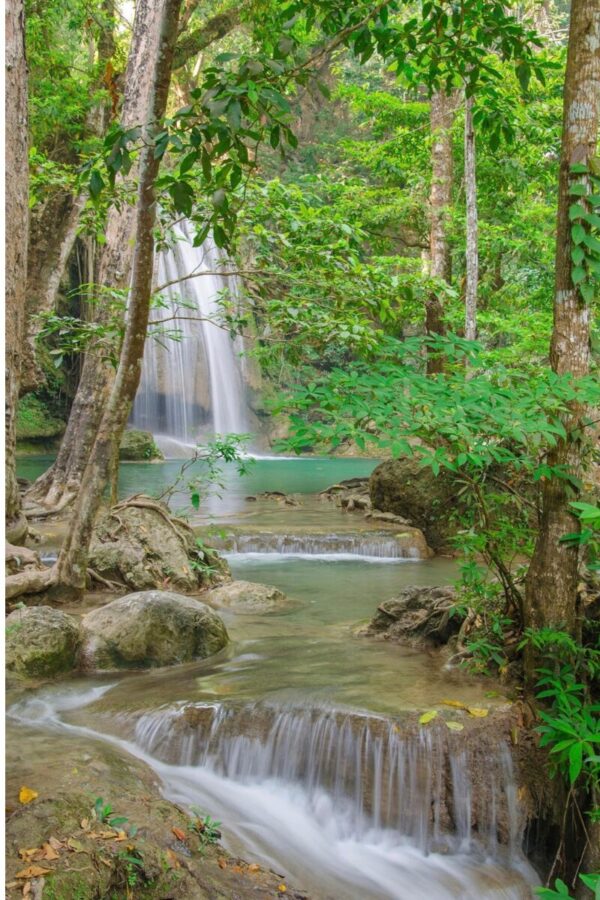 Erawan Falls in Thailand, a green lake with a waterfall dropping into it. The waterfall has 7 levels; I made it to level 5 (at 56, in 38 degrees and 98% humidity) before jumping into a pool