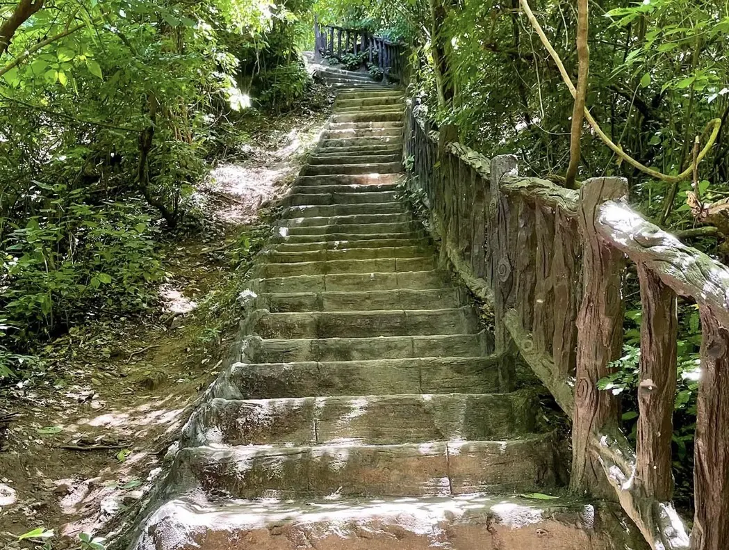 Steep steps between levels four and five at Erawan Falls in Kanchanaburi Province, Thailand. Level five is where travel blogger Alexandra decided she'd had enough climbing for the day