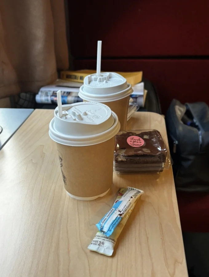 Coffee and brownies on a tray table, sleeper train from Bangkok to Chiang Mai.