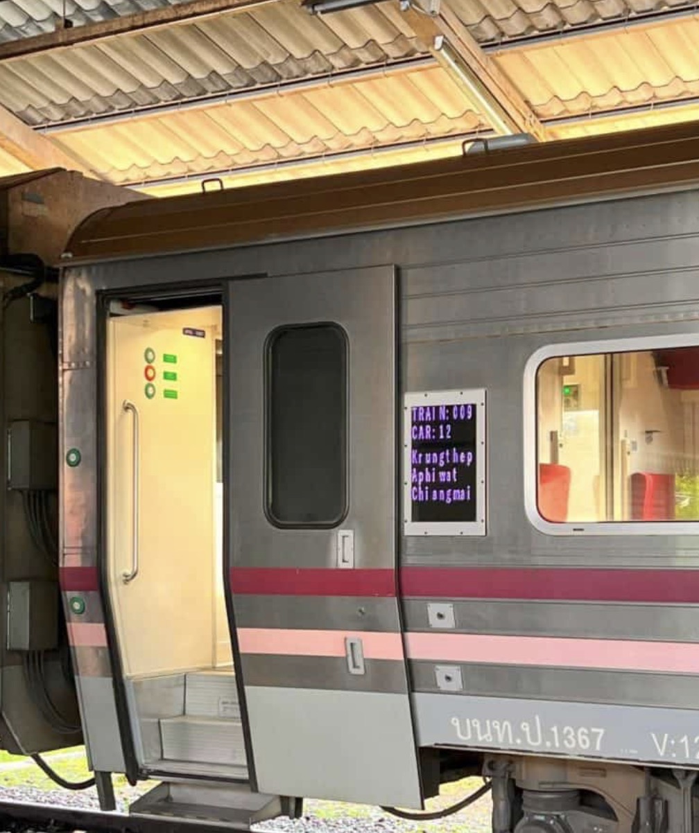 A train standing on a platform in Thailand