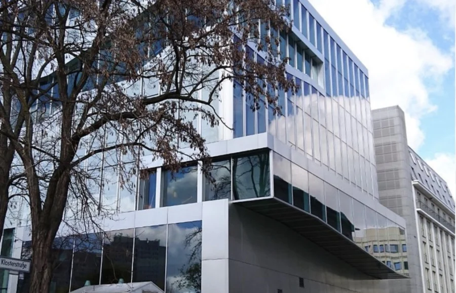 Modern building behind a tree, with a lot of windows. It's the Dutch embassy in Berlin. Closed when travel blog writer Alexandra (Tales from the road ahead) needed it to be open. 