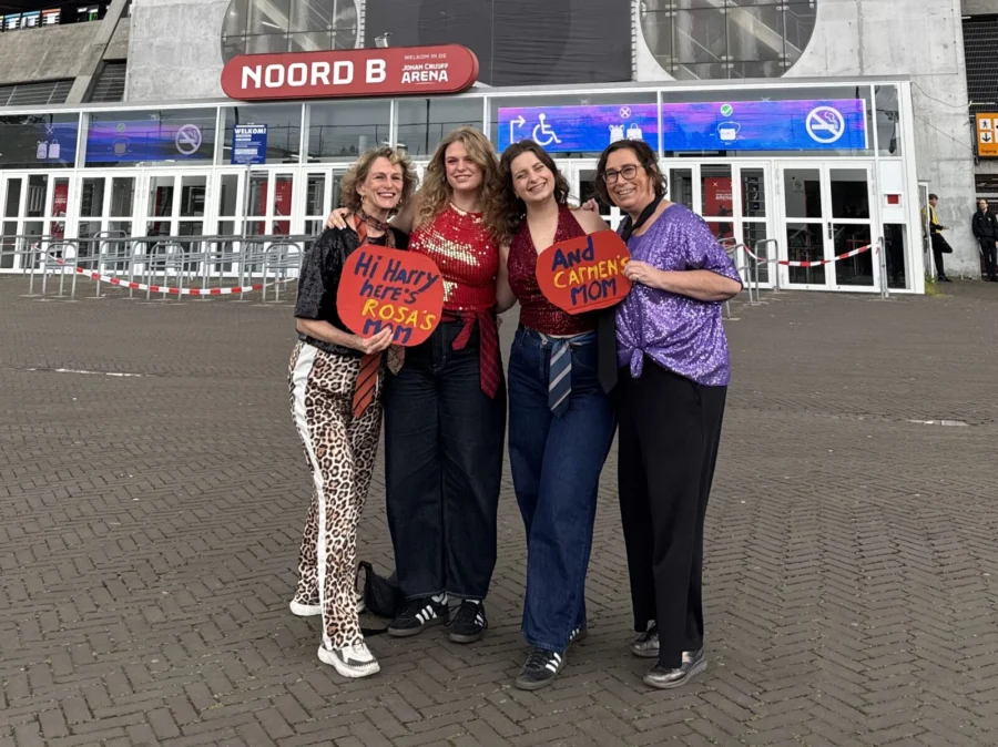 Two young women and their mothers standing outside the Amsterdam Arena, before going to a Harry Styles concert